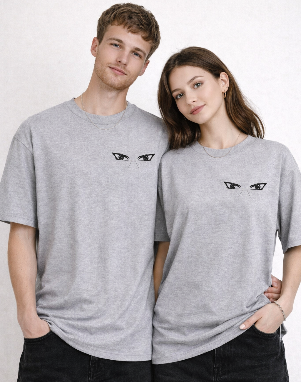Two people wearing gray t-shirts with a logo on a white background
